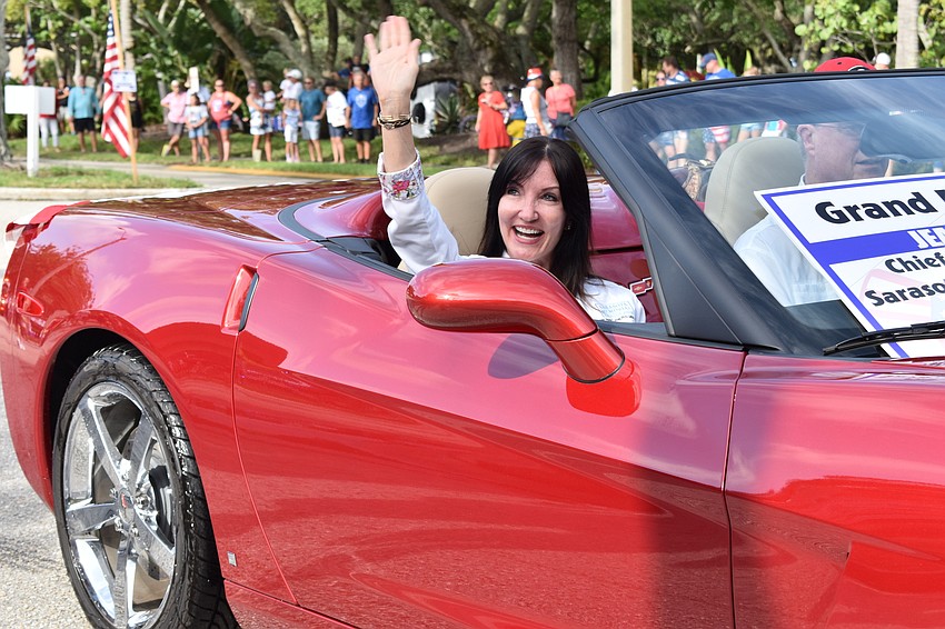 Sarasota Memorial Health Care System’s Chief Nursing Officer Jean Lucas waved during Sunday's Freedom Fest parade. Lucas served as one of the parade's grand marshals.