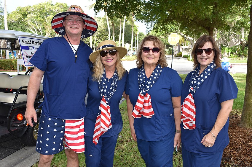 Todd Davis, Dr.  Colleen Healy, Linda Mazzaferro and Mary Grieco pose for a picture. Healy served as one of the parade's grand marshals.