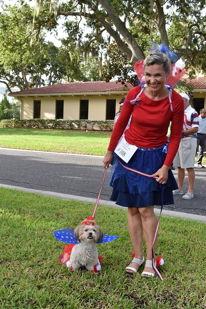 Martina Kinslow poses for a picture with her dog Tinker Bell.