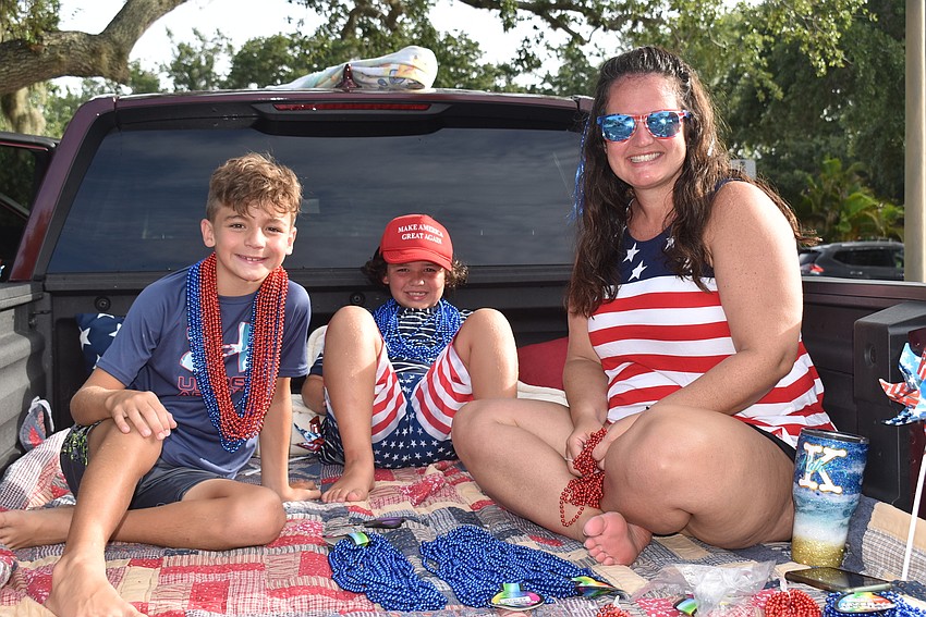 Finn Fontaine and Ollie and Katie Kimbrell in the Cadence Bank float.