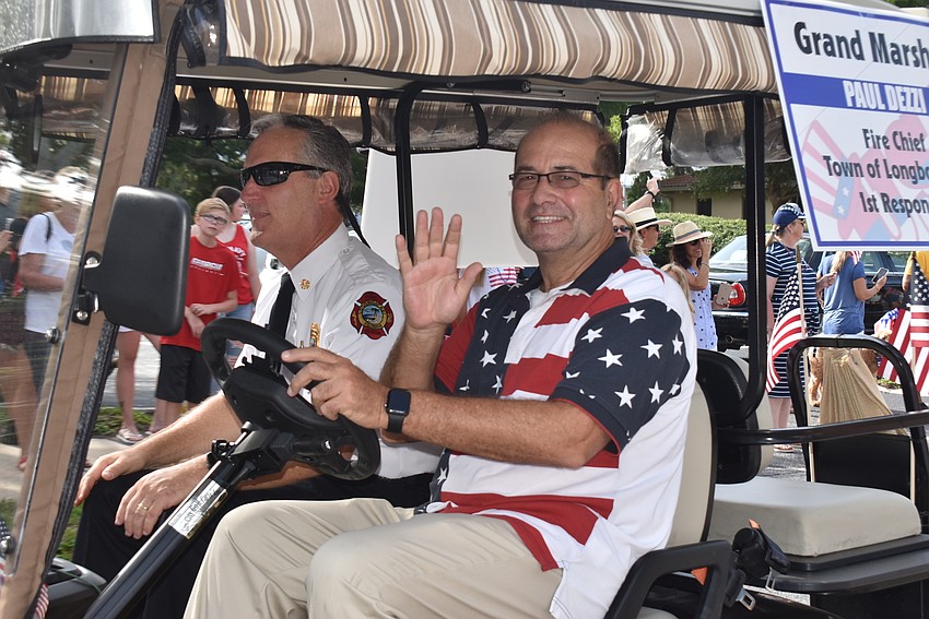 Town manager Tom Harmer, right, drove grand marshal and fire chief Paul Dezzi in the parade.