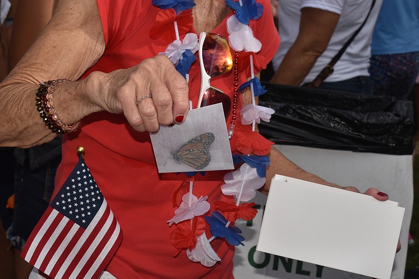 Susan Landau helped pass out butterflies before the release.