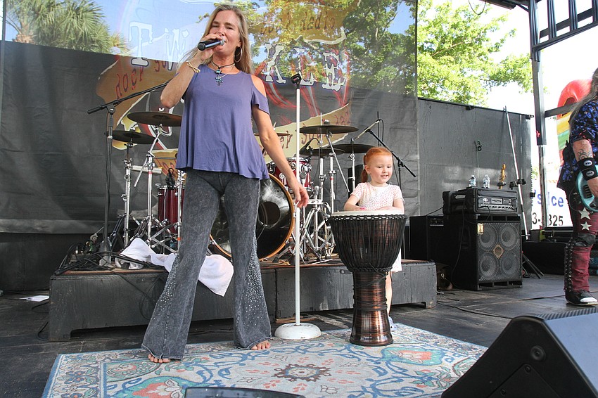 Alicia Herrera plays along with the music.