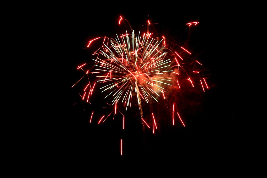 Various colored fireworks lit up the sky along Siesta Beach.