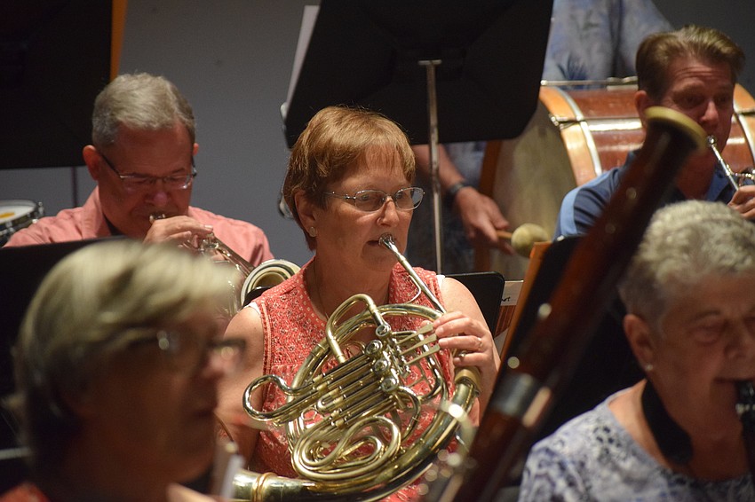 Sun City's Tina Stephanz, who plays the French horn, prepares to rehearse for American Fanfare.
