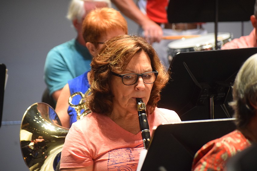 Susan Custer concentrates during rehearsal. She plays the clarinet.