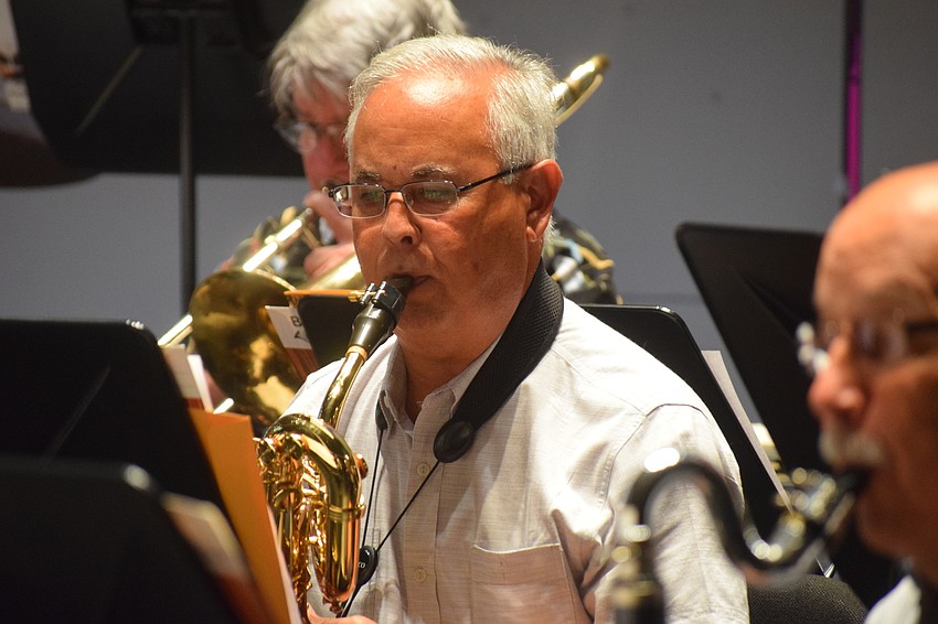 A day before American Fanfare at the Sarasota Opera House, Mel Davis practices on the baritone saxophone with the Lakewood Ranch Wind Ensemble.