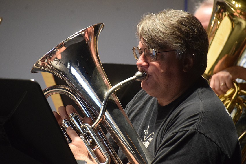 Bradenton's Bob Medlin rehearses with the euphonium as a member of the Lakewood Ranch Wind Ensemble.