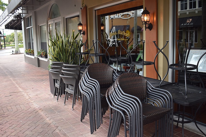 Most restaurants and shops at Main Street at Lakewood Ranch either stacked their outdoor furniture or removed it from the sidewalk although Elsa didn't pack much of a punch in Lakewood Ranch. Photo by Jay Heater