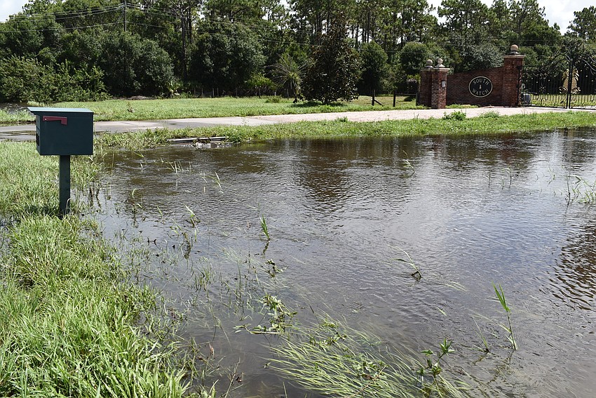 Water flows into a drain outside a Myakka City property along County Road 675 on Wednesday morning. Photo by Brendan Lavell