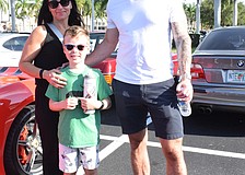 Lakewood Ranch's Ella Hoy enjoys seeing her 7-year-old son, Enzo, and husband, Matt, who are car fanatics marvel over the various cars at Coffee and Cars.