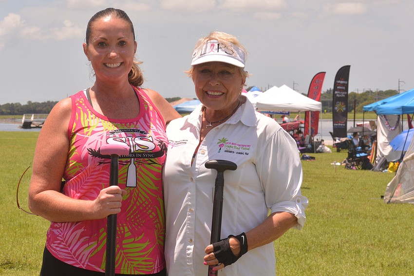 Carla Cwiertnia and JoAnn Moore, Lakewood Ranch residents, row for Survivors in Sync. They competed at the 2021 Sarasota International Dragon Boat Festival. While Moore is a veteran, Saturday's festival was Cwiertnia's first race.