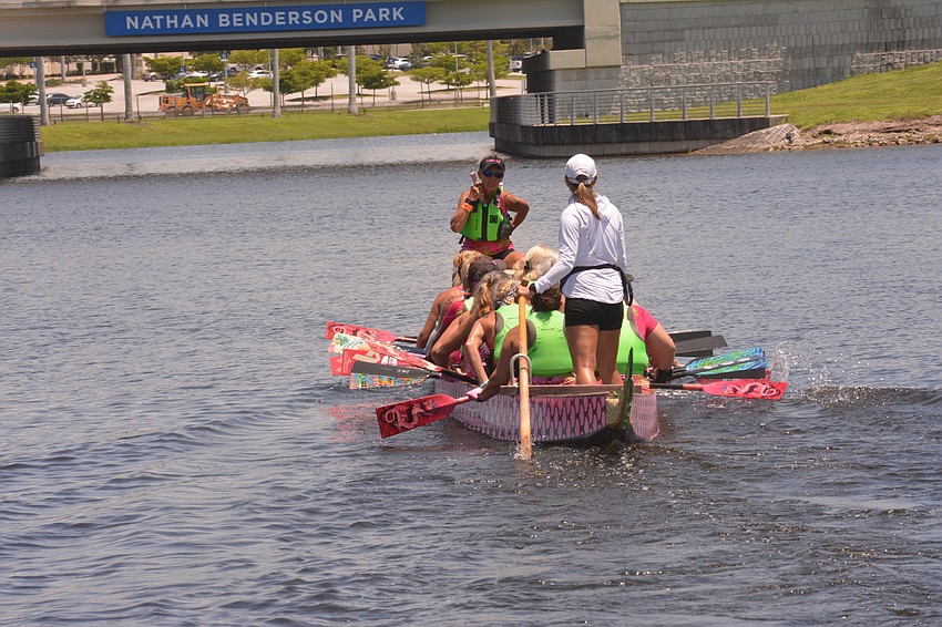 Sarasota's Survivors in Sync 200-meter dragon boat team paddled to a win against the Warriors on Water on Saturday.