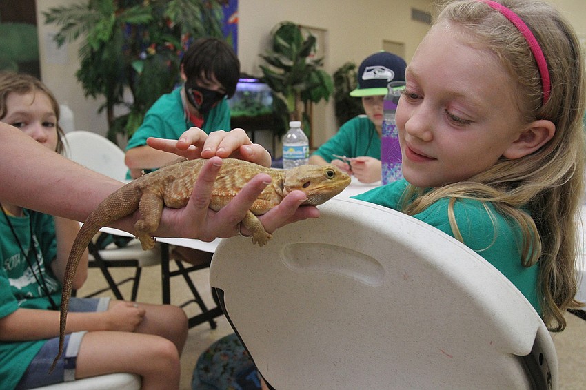 Sylvia Adams, 9, pets Potato.
