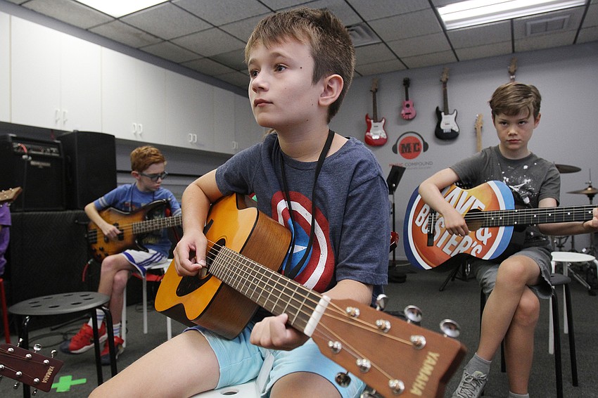 Christian Bathori, 9, listens closely to his instructors.