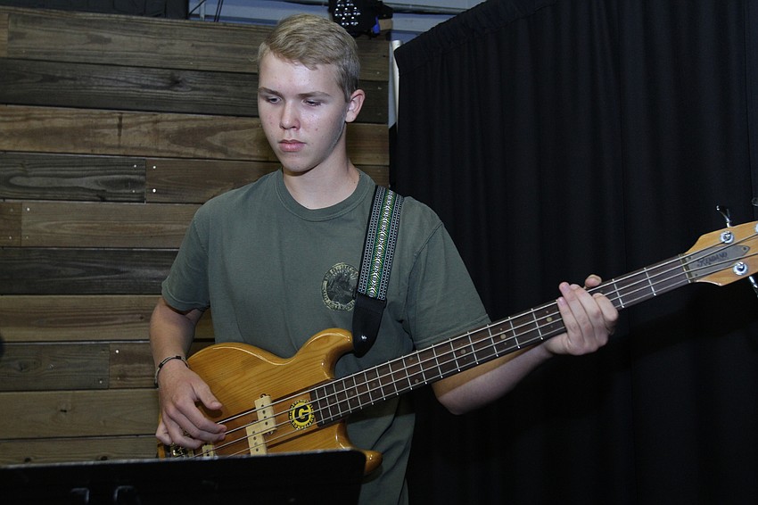 Nicholas Matthias, 13, plays guitar.