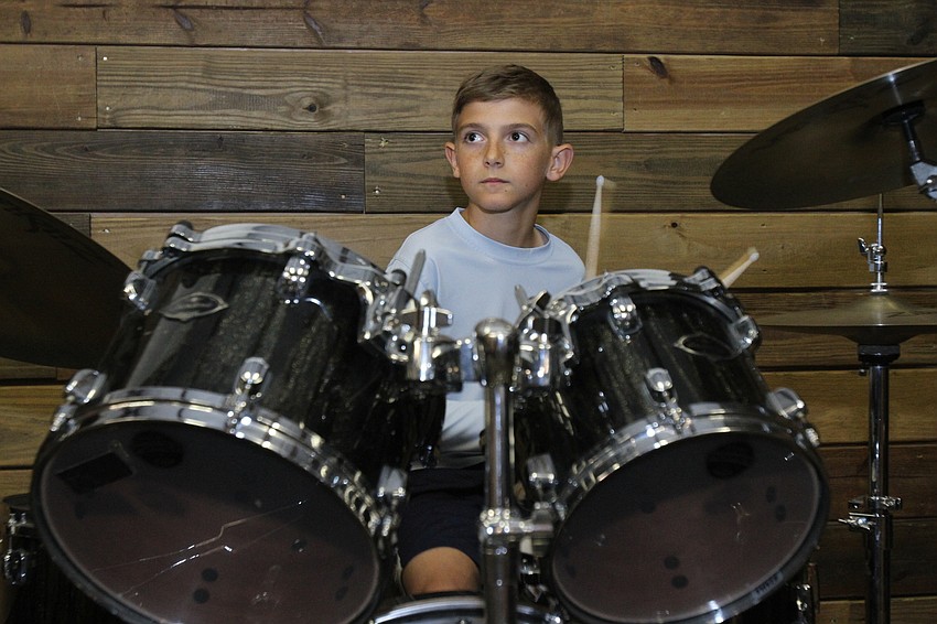 Jack Wilson, 11, goes off on the drums.
