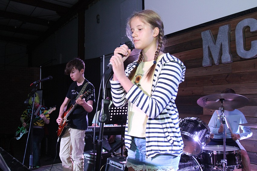 Aimee Mongiovi and the rest of the campers compose the 