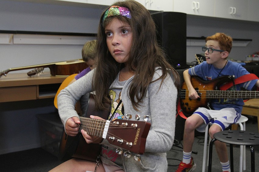 Katerina Vergnais, 6, pays attention to the lesson.
