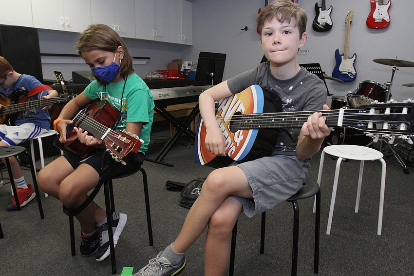 Riley Jimenez, 8, and Kennan WIlson, 8, cut loose at the back.