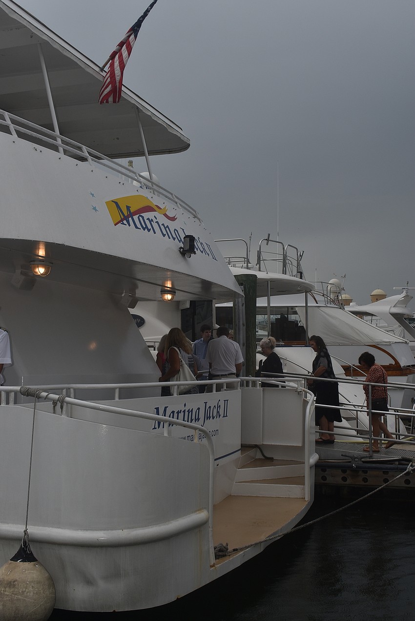 St. Mary's parishioners board the Marina Jack II.