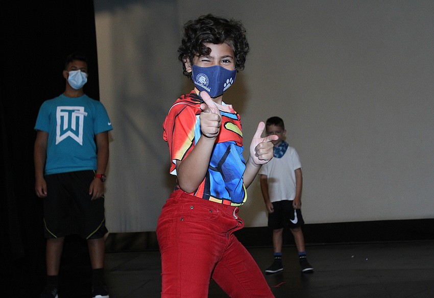 Karim Musmar, 9, executes his pose.