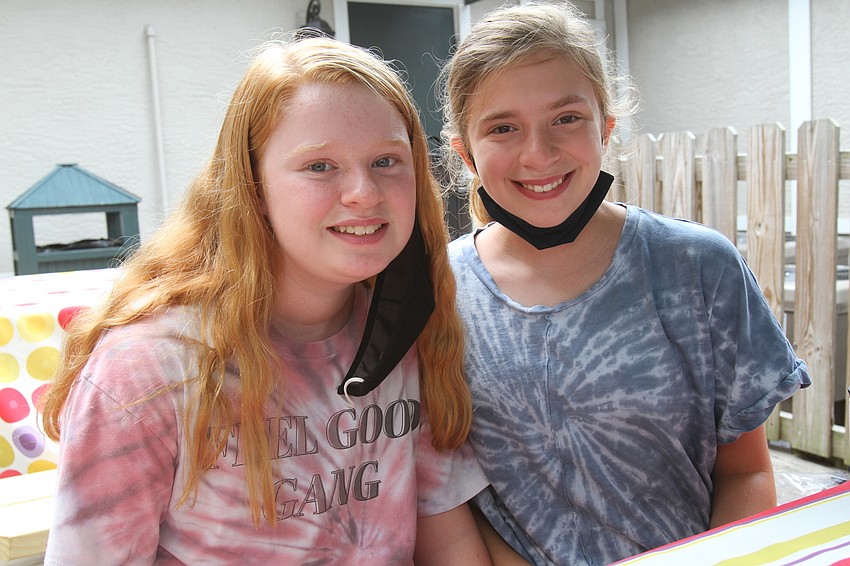 Fiona and Maeve Wilkins take some time to eat.