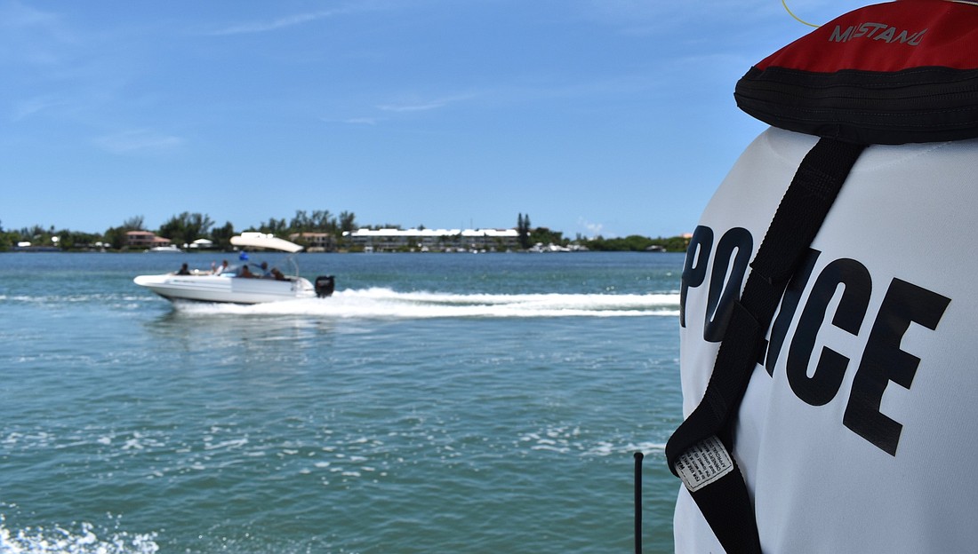Longboat Key marine patrol officer Joshua Connors drives the town&#39;s police boat.