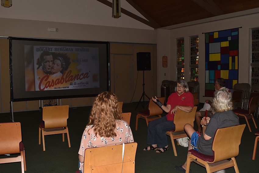 Moviegoers took their seats in the fellowship ha..