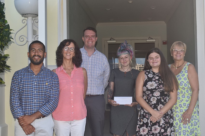 Diego Velasco and Peg Hughes from Visible Men Academy, Jonathan Evans from Healthy Teens Coalition, Megan Howell from Second Heart Homes, Emma Bittar from Healthy Teens Coalition and Brenda Zofrea from Visible Men Academy.