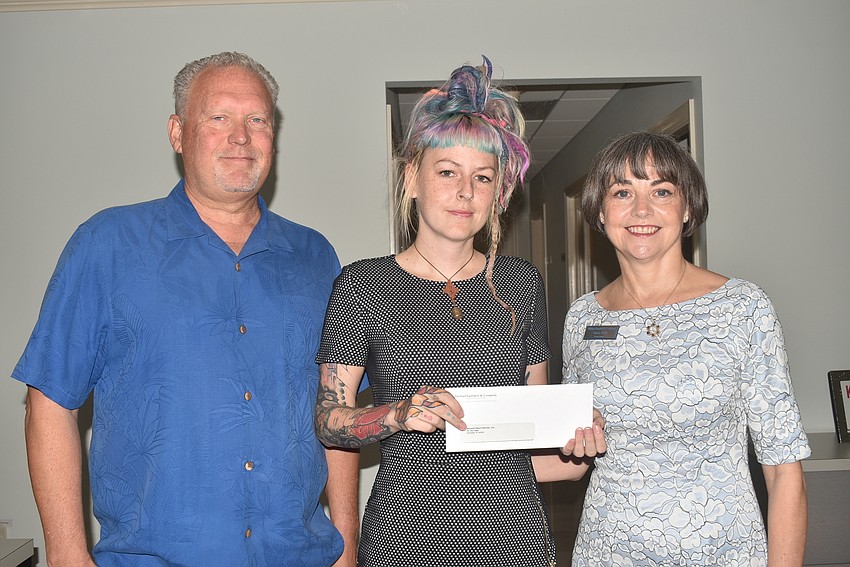 Sean Clark, who nominated the organization, Megan Howell from Second Heart Homes and Sharon Gould.