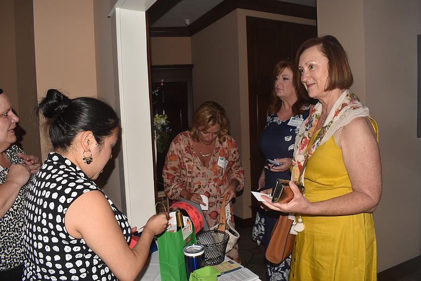 Gayle Goodfriend bought raffle tickets before heading in.