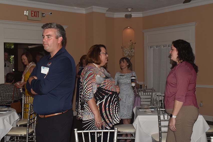 Members mingled in the dining room before sitting down to lunch.