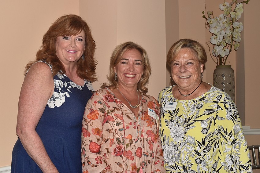 New members Regina Baker and Patti Bosco with chamber President Gail Loefgren