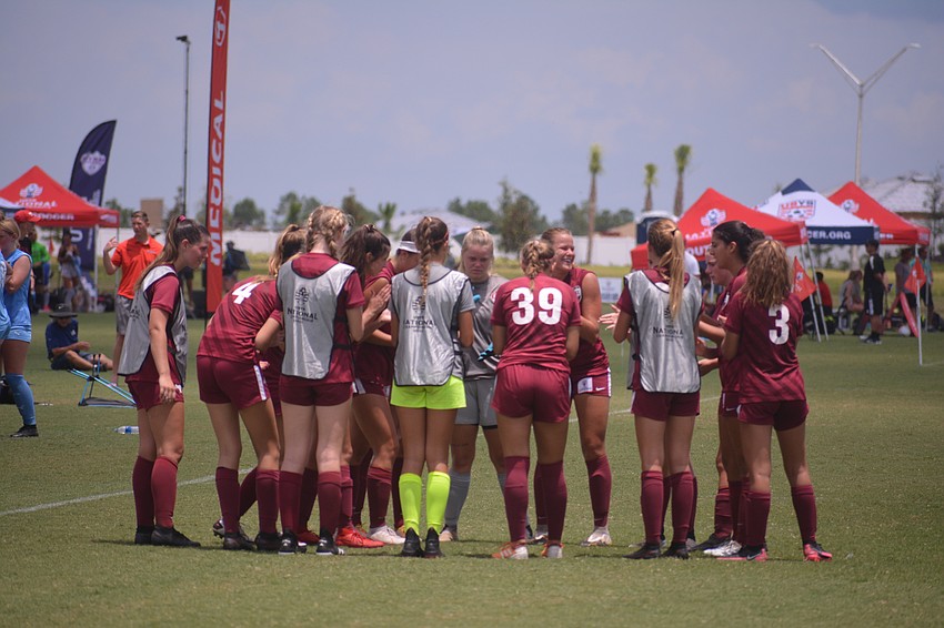 The Pirates talk things over at halftime.