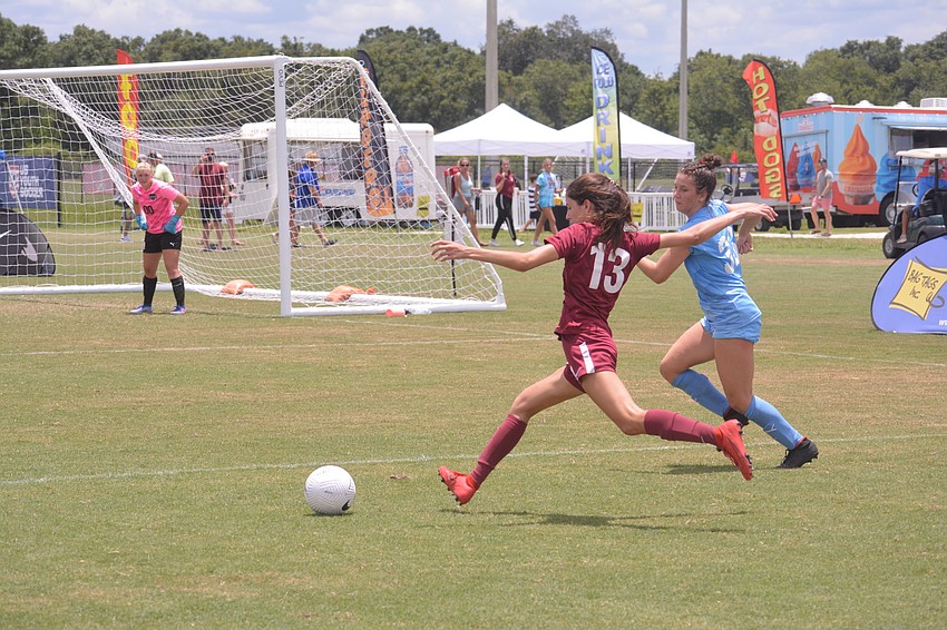 Sierra Spirk slams a shot at the goal for Braden River SC.