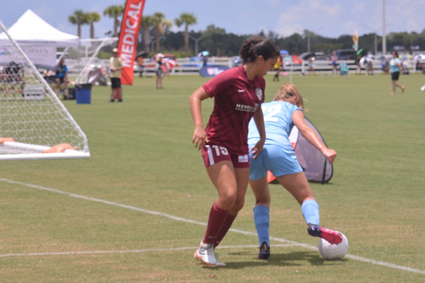 Sarah Freddolino bodies a Cleveland FC player — and the ball — out of -bounds.
