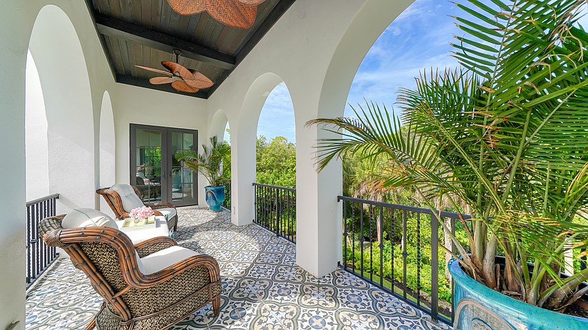 The back yard is tropically landscaped and offers about 145 feet of deep-water canal frontage.