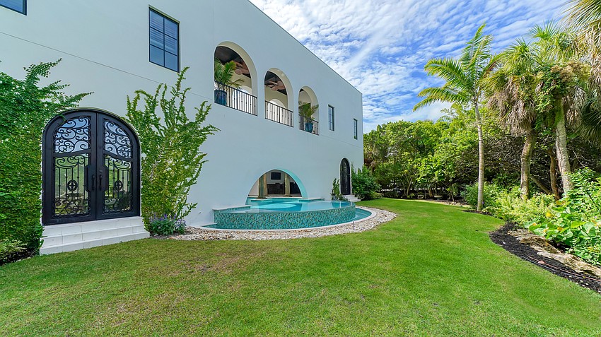 The lap pool includes a swim out into the back yard.