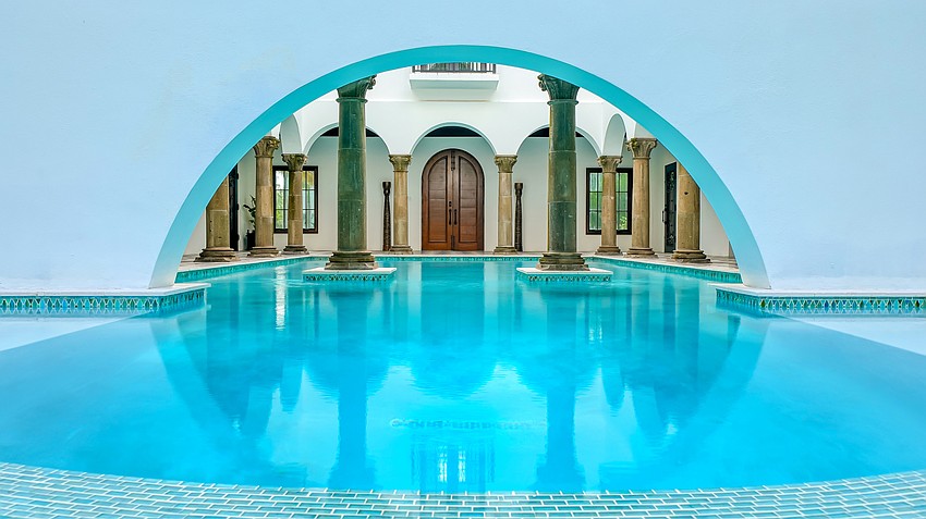 The lap pool includes a swim out into the back yard.