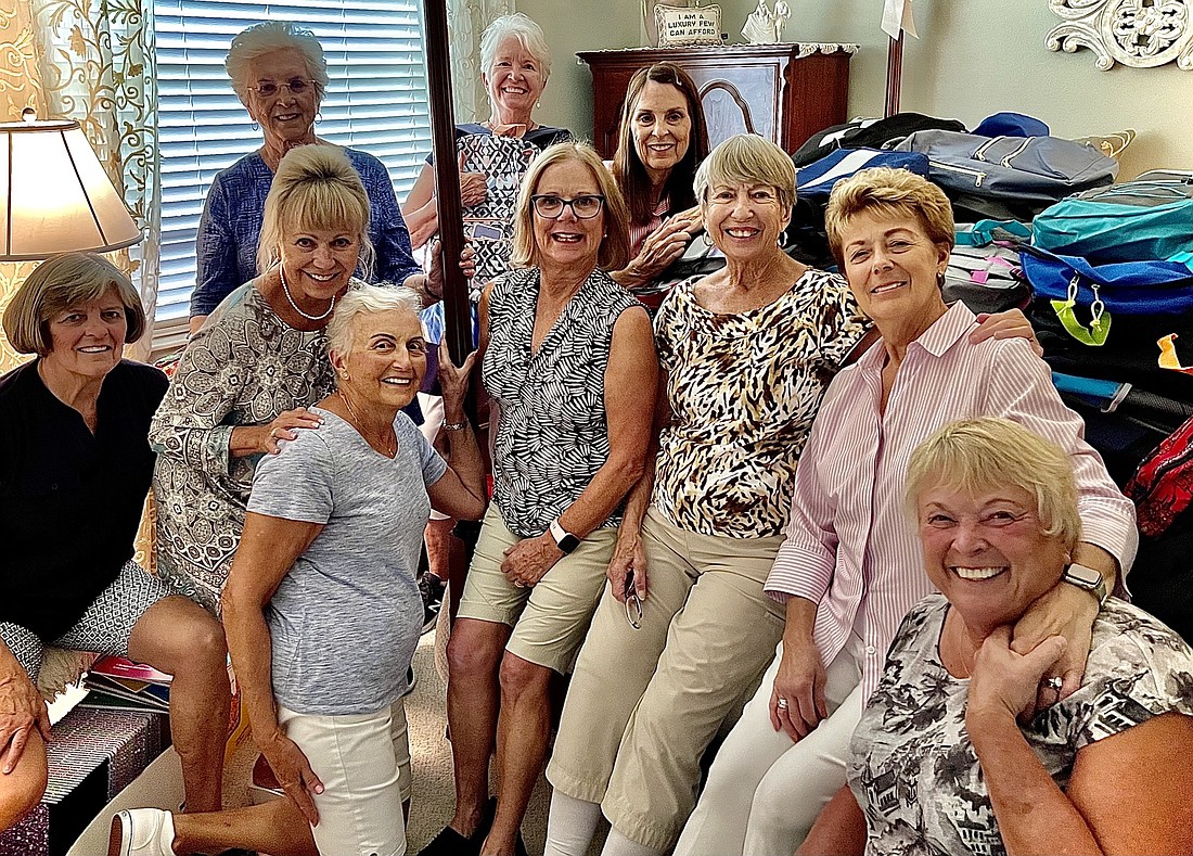 Lakewood Ranch women help stuff backpacks for Stillpoint Mission to donate to children. Courtesy photo.