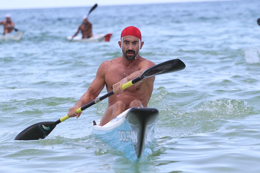 Konrad Ciolko of Clearwater Beach paddles to the finish line.