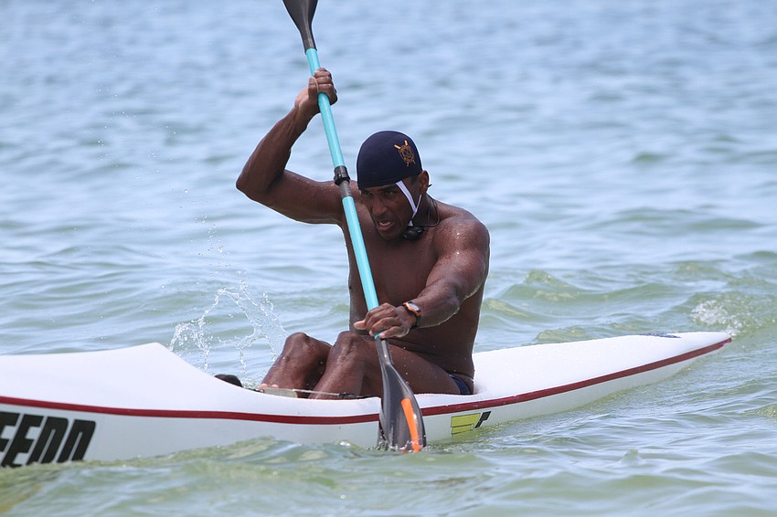 Jose Bolivar of Hollywood, Florida paddles to the shore.