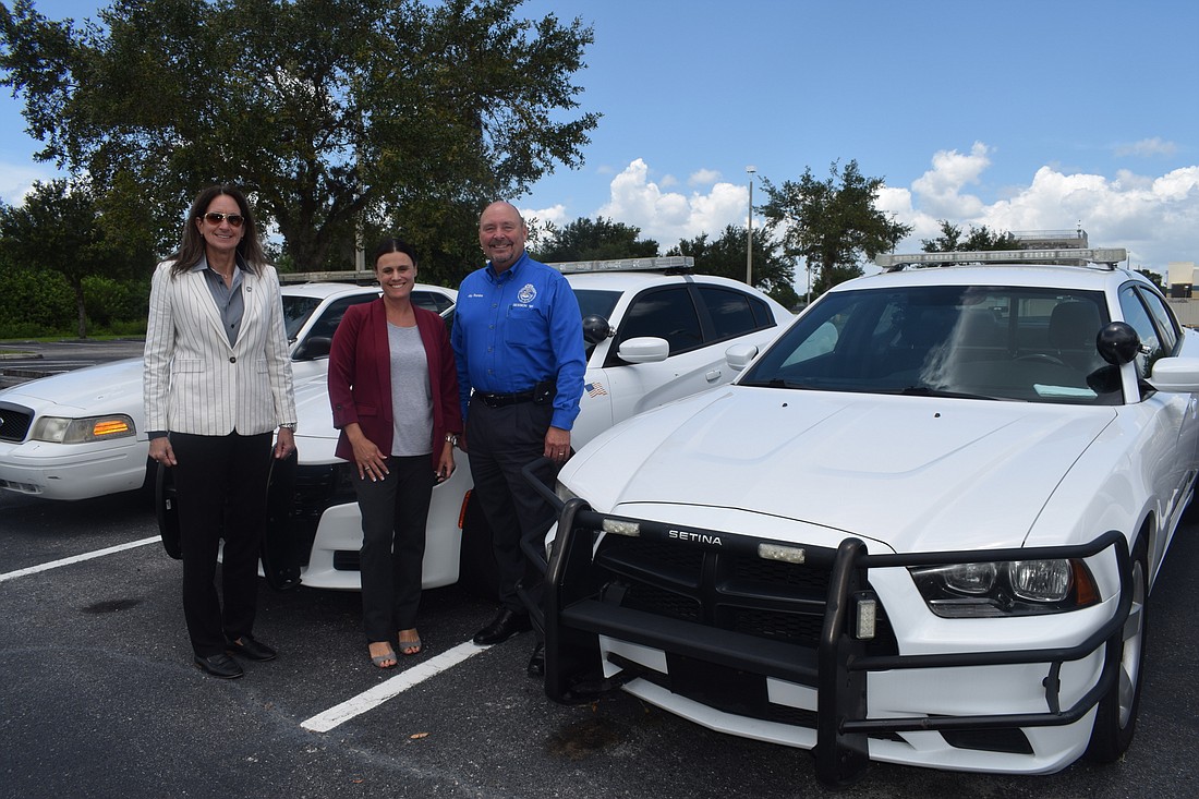 Melanie Bevan, the chief of the Bradenton Police Department, Jennifer Gilray, the assistant director of MTC&#39;s east campus, and Jay Romine, the law enforcement program director at MTC, work to open a firing range and driving course