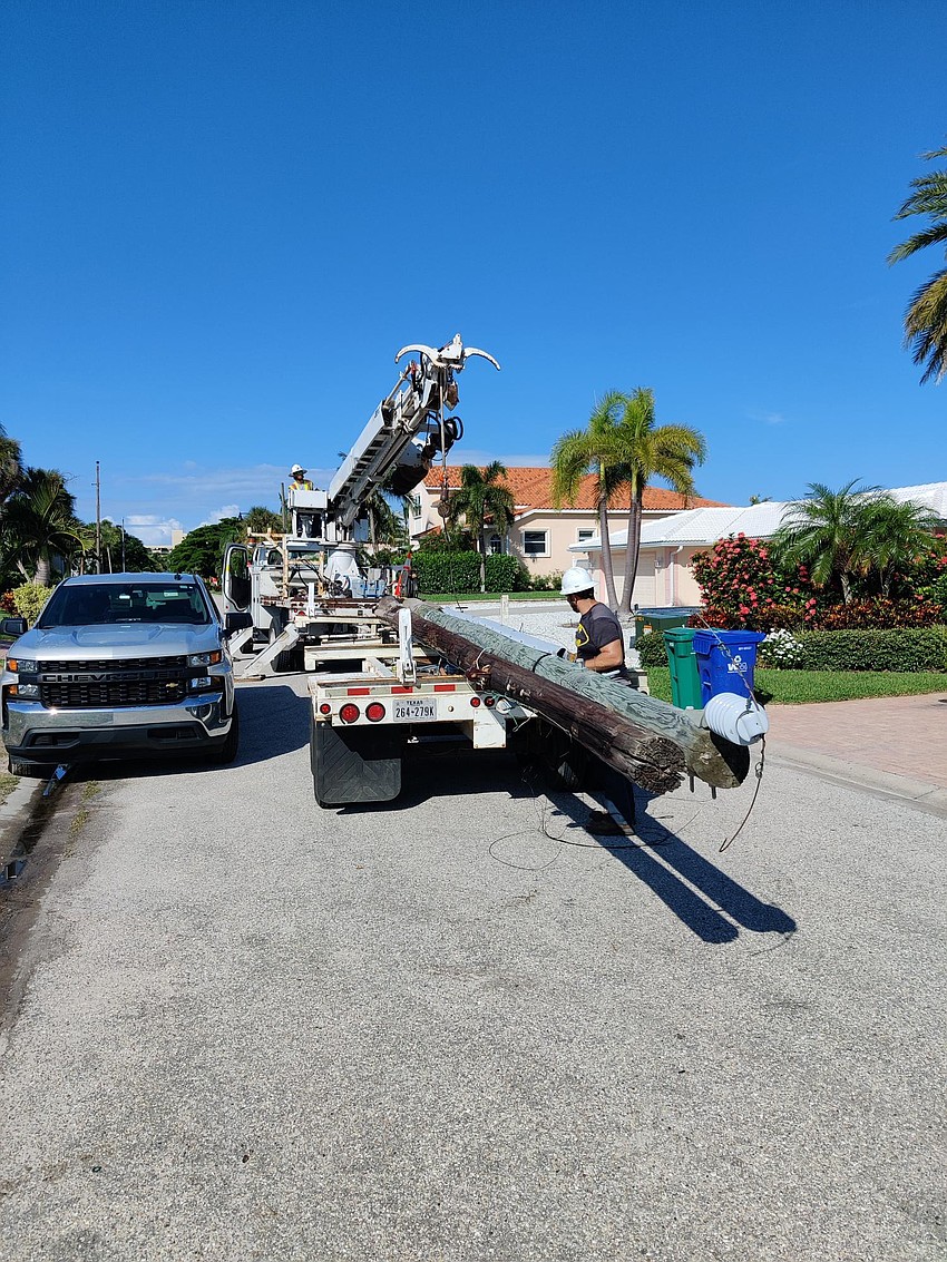 On July 19, crews worked to remove light poles on Putting Green Lane. Photo provided by the town of Longboat Key.
