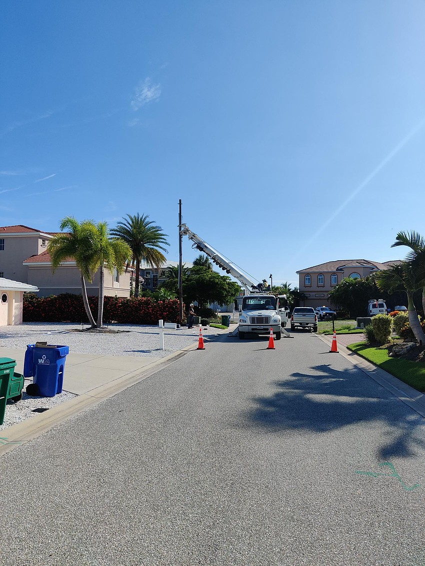 On July 19, crews worked to remove light poles on Putting Green Lane. Photo provided by the town of Longboat Key.