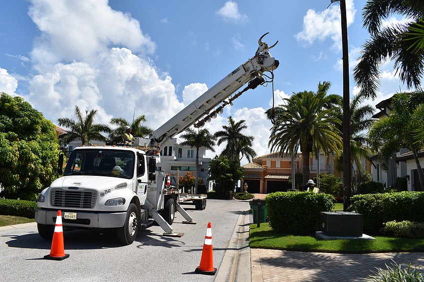 On July 22, Volt Power Co. lineman Heston Braddock worked to remove a light pole from Birdie Lane.