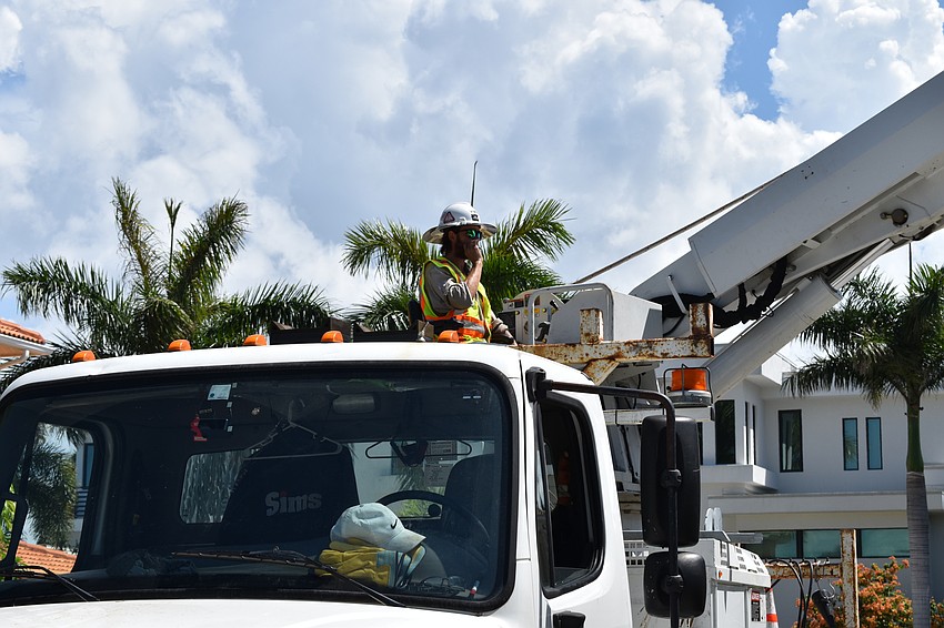 On July 22, Volt Power Co. lineman Heston Braddock worked to remove a light pole from Birdie Lane.