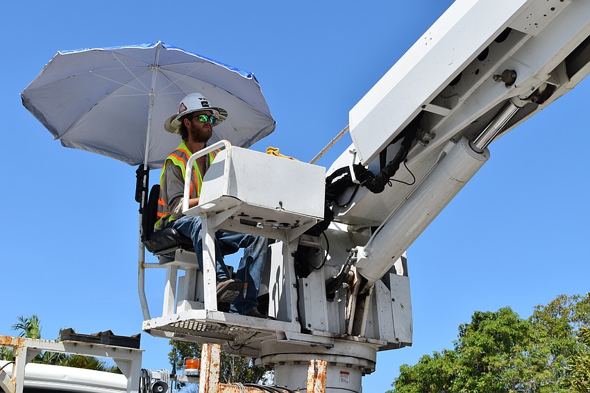 On July 22, Volt Power Co. lineman Heston Braddock worked to remove a light pole from Birdie Lane.