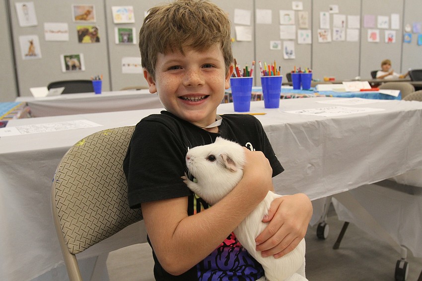 Levi Bolenski, 6, plays with Squeak.